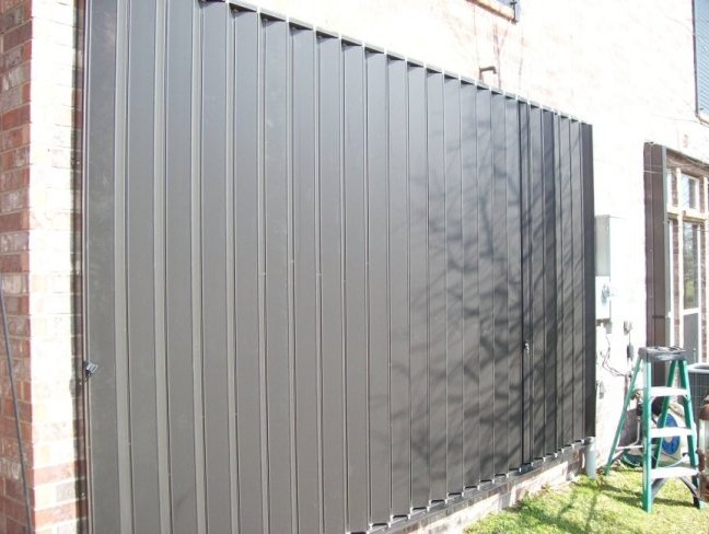 Protecting large windows, doors or glass enclusures takes only seconds with accordion hurricane shutters.