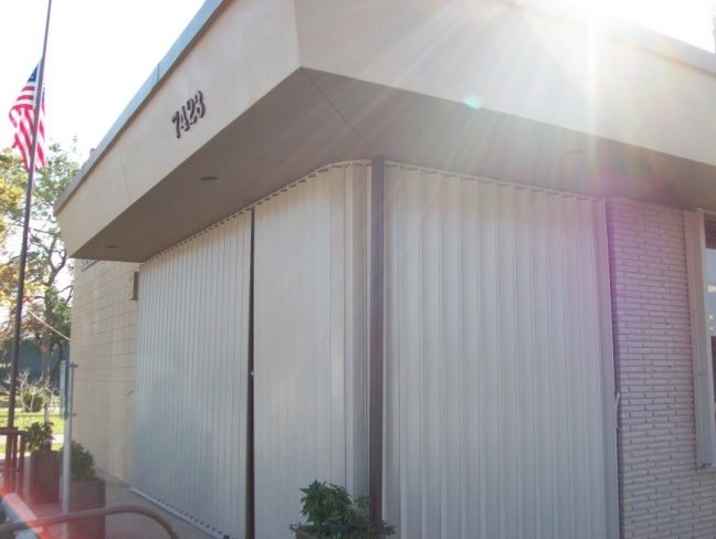 Accordion shutters are excellent for securing commercial buildings from storms and breakins.